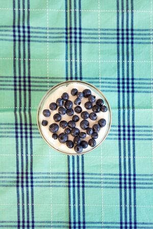 Bowl of granola with yogurt and blueberry for breakfastの写真素材