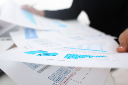 businesswoman study documents in office closeup paperwork conceptの写真素材