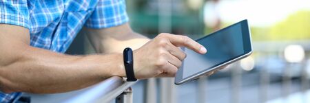 Male businessman hold tablet in handの写真素材