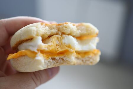 Male hand holding fresh sandwich closeupの写真素材