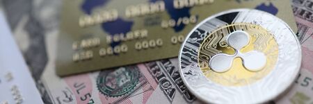 Silver coin ripple XRP closeup lie on tableの写真素材