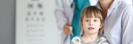 Happy smiling family at child doctor officeの写真素材