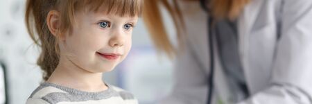 Little girl with doctorの写真素材