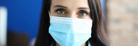 Woman in protective medical mask from viruses.の写真素材