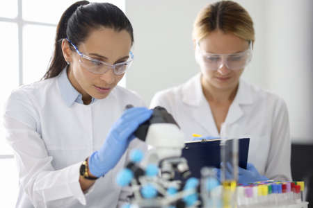 Two researchers in laboratory are doing research.の写真素材