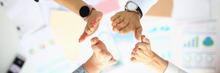 Business people over the work table are greeting hands.の写真素材