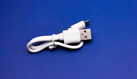 A white USB cable against