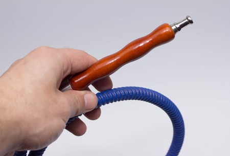 Parts of the hookah on blue wooden background. Hookah accessorie