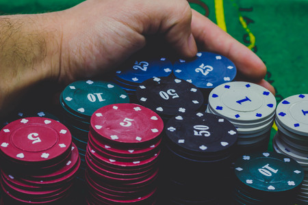 Casino chips and Dealer on top