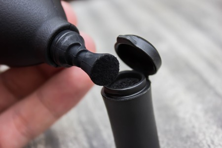 Camera cleaning vacuum pump on wood table blackの写真素材