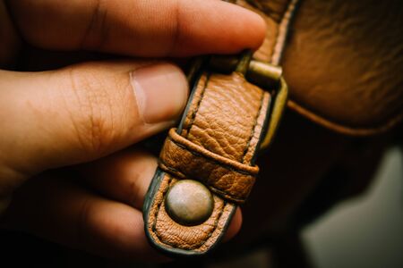 hand lock buttons on the briefcase backgroundの写真素材