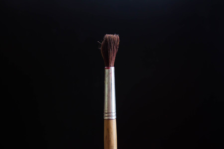 Paint brushes in a jar on black background, Franceの写真素材