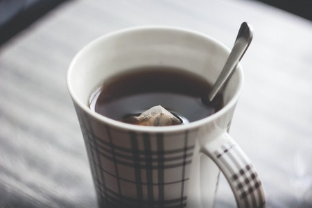 Tea bag put in transparent teacup foodの写真素材