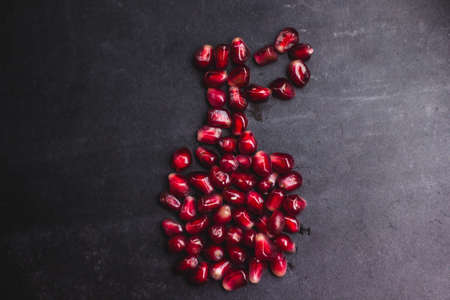 Delicious pomegranate fruit on black background foodの写真素材