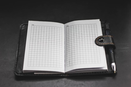 blank notebook on a black background textbookの写真素材