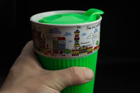 green mug on black backgroundの写真素材