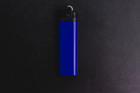 blue lighter on a black backgroundの写真素材