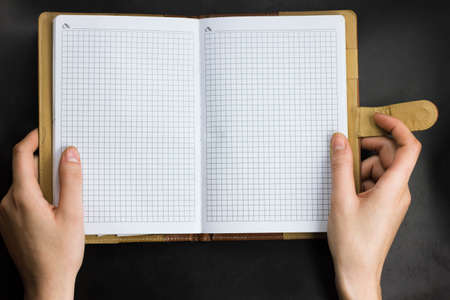 open notebook on a blak background officeの写真素材