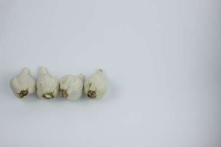 Peeled Garlic (close-up shot) on vintage white backgroundの写真素材