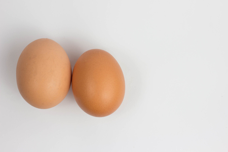 Fresh brown cage free eggs on burlap. Macro with shallow dof stillの写真素材