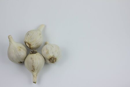 Garlic with leaves of parsley isolated on white foodの写真素材