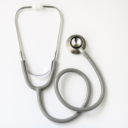 Gray stethoscope isolated on white background. Medical instruments used to hear sounds within the patient's body.の写真素材