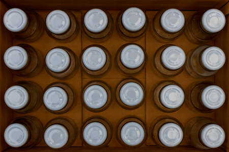 glass bottles in a cardboard box without partitions for transporting broken items.の写真素材