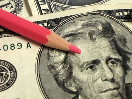 money (dollars) with red pencilの写真素材