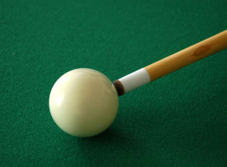                                 pool cue ready to strike the ball の写真素材
