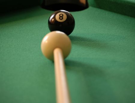                                 Eight ball ready to be struck by the que ballの写真素材