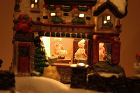 Old ceramic christmas village scene on displayの写真素材