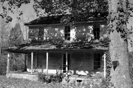 Black and white photo of an old abandoned houseの写真素材