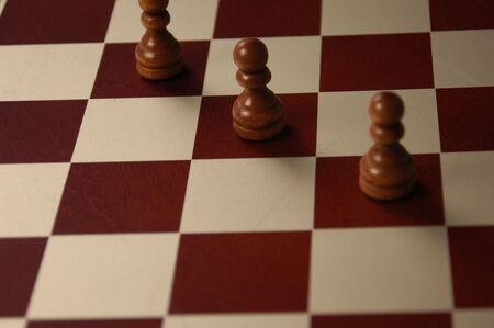 Three chess pawns lined up for the attackの写真素材
