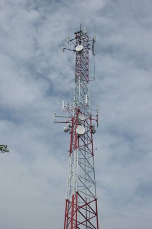 A large cell phone tower rising into the skyの写真素材