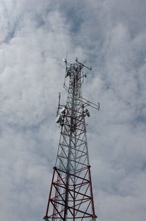 A large cell phone tower rising into the skyの写真素材