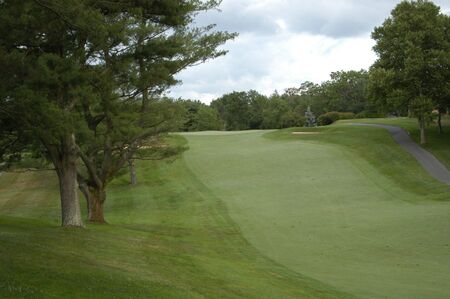 A golf fairway along a rolling courseの写真素材