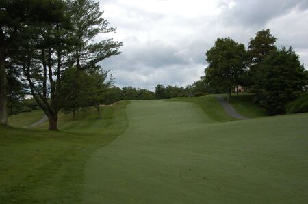 A golf fairway along a rolling courseの写真素材