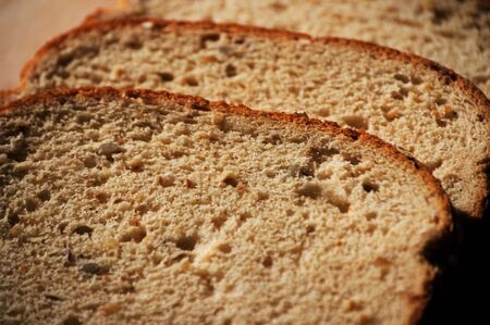 three slices of whole grain wheat breadの写真素材