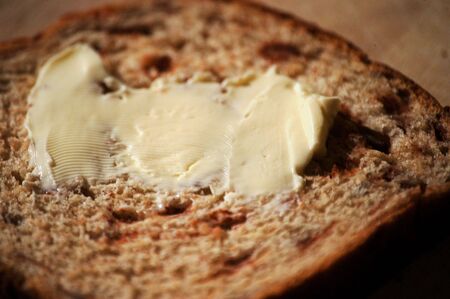 cinnimon bread with fresh butter on itの写真素材