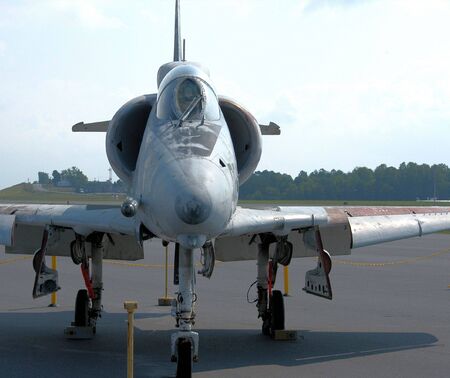 A jet fighter plane parked an airportの写真素材