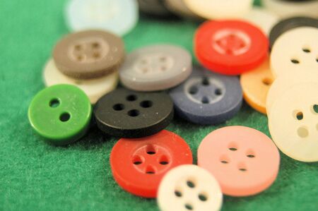 A pile of buttons on a field greenの写真素材