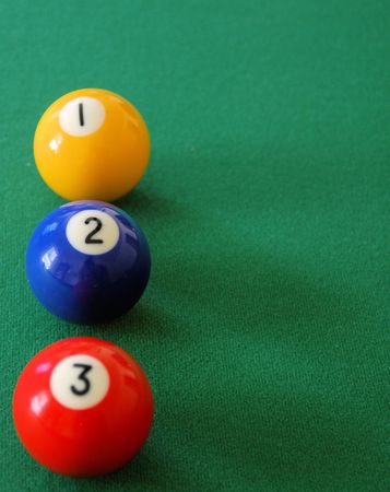 Three pool balls on the table in number order