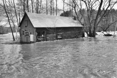 old barn during a flood,shown in black and whiteの写真素材