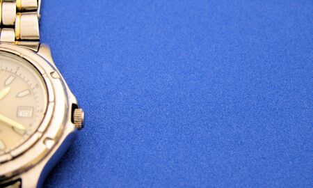 View of a watch up close on a blue backgroundの写真素材