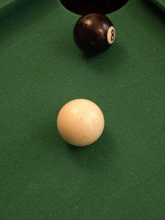 eight ball on the edge ready to be sunkの写真素材