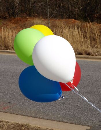 Balloons up close in the road to show where to turnの写真素材