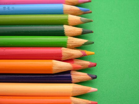 Colored pencils shown in a row closeupの写真素材