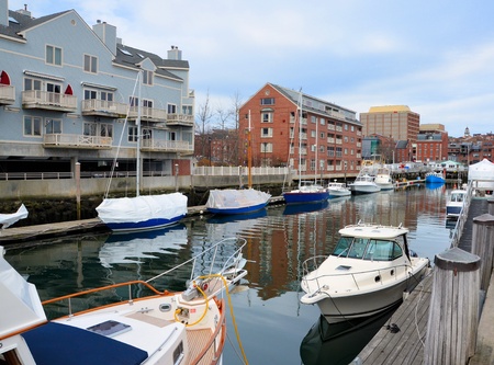 Boats along a dock covered up until spring arrivesのeditorial素材