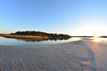 A view of the shore around the north end of Carolina Beach at sunsetの写真素材