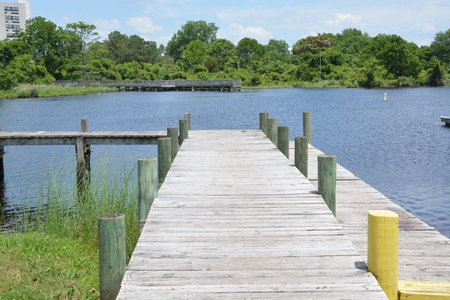 A wooden boat dock ready for use on a warm summer day.の写真素材
